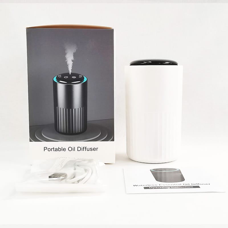 portable scent diffuser for car and desktop front view white color, box and accesories