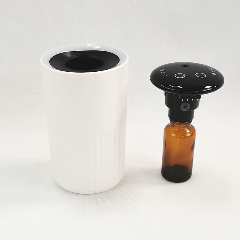 portable scent diffuser for car and desktop front view white color, and fragrance reservoir