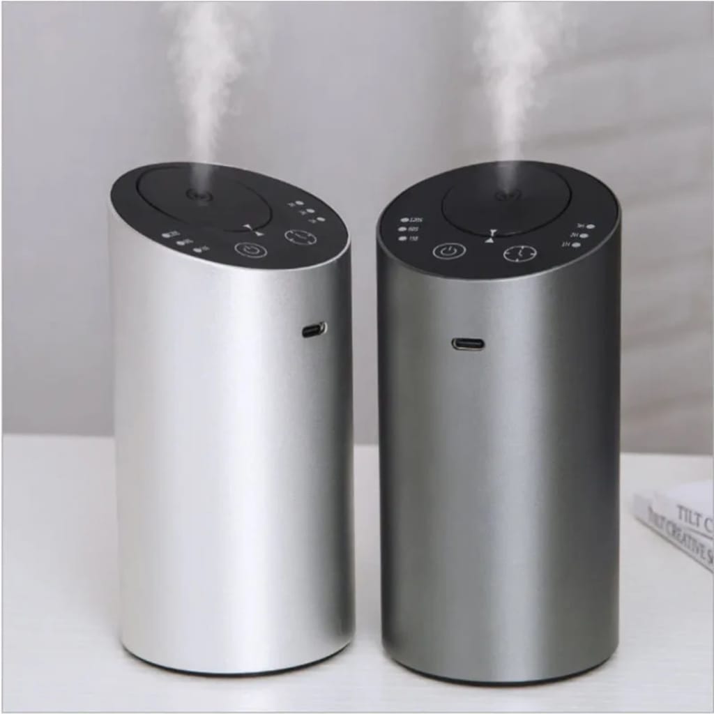 two Scent diffusers, one gray and the other silver